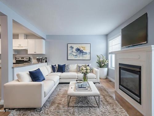 195 230 Edwards Drive, Edmonton, AB - Indoor Photo Showing Living Room With Fireplace