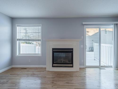 195 230 Edwards Drive, Edmonton, AB - Indoor Photo Showing Living Room With Fireplace