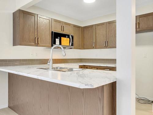 126 150 Edwards Drive, Edmonton, AB - Indoor Photo Showing Kitchen With Double Sink