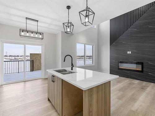 2028 155 Avenue, Edmonton, AB - Indoor Photo Showing Kitchen With Fireplace With Double Sink