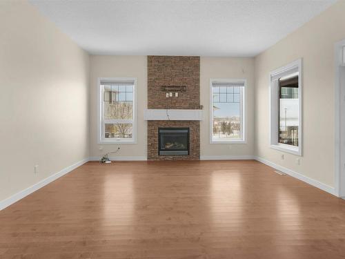 3071 Carpenter Landing, Edmonton, AB - Indoor Photo Showing Living Room With Fireplace