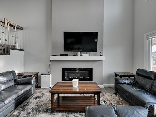 9325 Cooper Bend, Edmonton, AB - Indoor Photo Showing Living Room With Fireplace