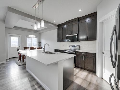 9325 Cooper Bend, Edmonton, AB - Indoor Photo Showing Kitchen With Double Sink With Upgraded Kitchen