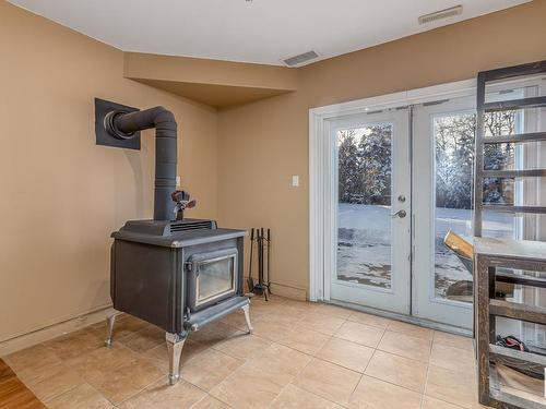 3 Zahar Drive, Rural Sturgeon County, AB - Indoor Photo Showing Other Room With Fireplace