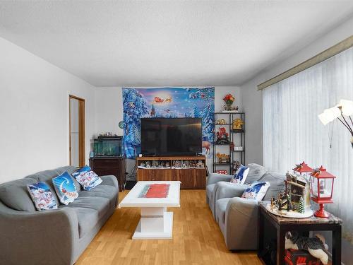 8004 130 Avenue, Edmonton, AB - Indoor Photo Showing Living Room With Fireplace