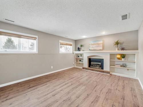 4102 34 Avenue, Leduc, AB - Indoor Photo Showing Living Room With Fireplace