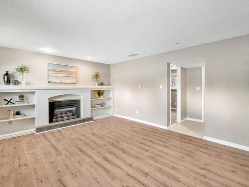 4102 34 Avenue, Leduc, AB - Indoor Photo Showing Living Room With Fireplace