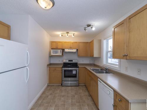 121 12050 17 Avenue, Edmonton, AB - Indoor Photo Showing Kitchen With Double Sink