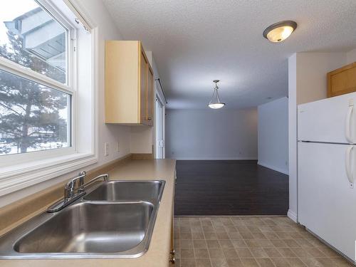 121 12050 17 Avenue, Edmonton, AB - Indoor Photo Showing Kitchen With Double Sink