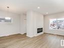 41 Gambel Loop, Spruce Grove, AB  - Indoor Photo Showing Living Room With Fireplace 