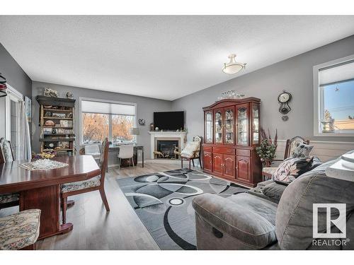 4 4908 43 Street, Legal, AB - Indoor Photo Showing Living Room With Fireplace