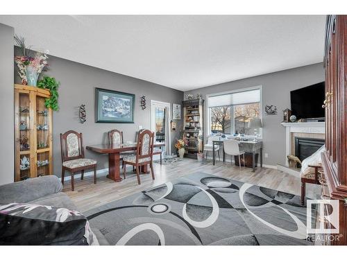 4 4908 43 Street, Legal, AB - Indoor Photo Showing Living Room With Fireplace