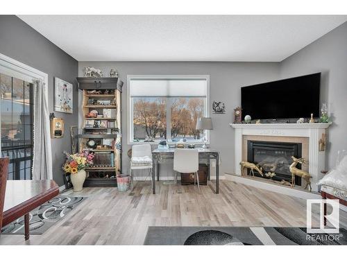 4 4908 43 Street, Legal, AB - Indoor Photo Showing Living Room With Fireplace