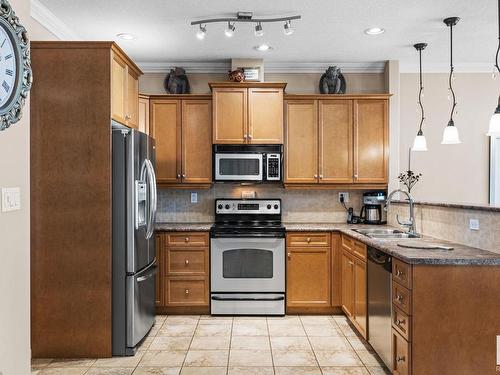 7 13808 155 Avenue, Edmonton, AB - Indoor Photo Showing Kitchen With Double Sink