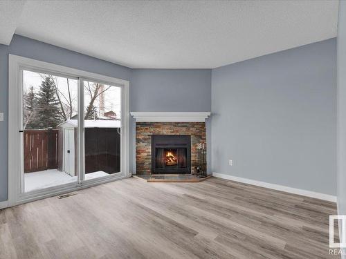 658 Lakewood Road, Edmonton, AB - Indoor Photo Showing Living Room With Fireplace