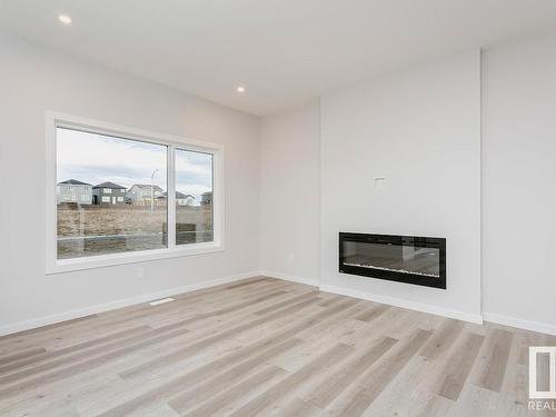 657 Kinglet Boulevard, Edmonton, AB - Indoor Photo Showing Living Room With Fireplace