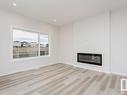 657 Kinglet Boulevard, Edmonton, AB  - Indoor Photo Showing Living Room With Fireplace 