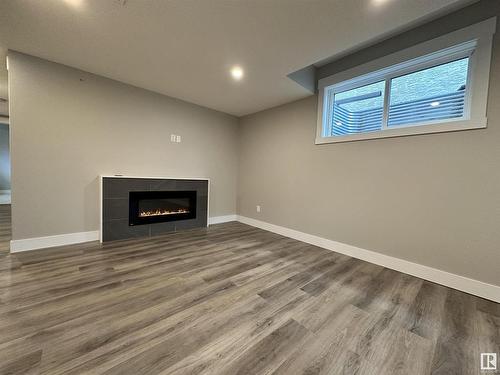 8420 117 Street, Edmonton, AB - Indoor Photo Showing Other Room With Fireplace