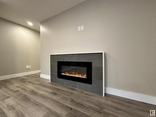 8420 117 Street, Edmonton, AB - Indoor Photo Showing Living Room With Fireplace