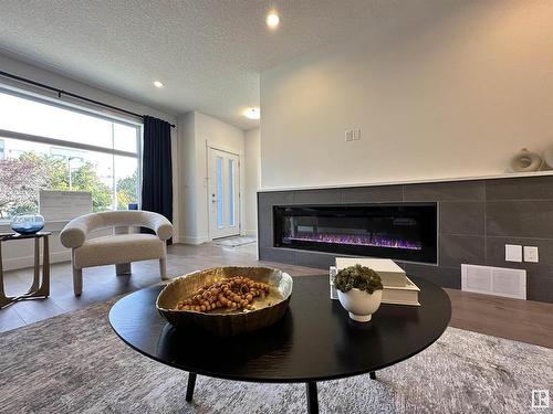 8420 117 Street, Edmonton, AB - Indoor Photo Showing Living Room With Fireplace