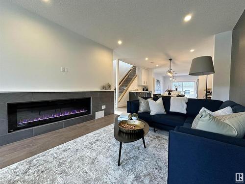 8420 117 Street, Edmonton, AB - Indoor Photo Showing Living Room With Fireplace