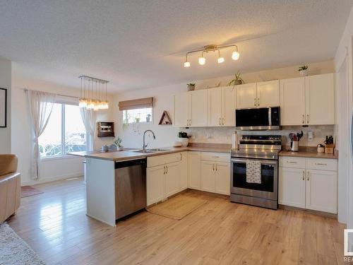 48 Vaughn Avenue, Spruce Grove, AB - Indoor Photo Showing Kitchen With Double Sink