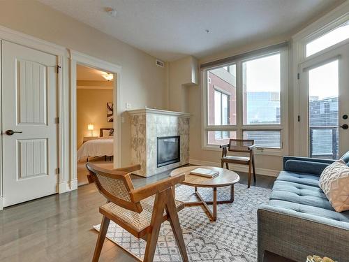 807 10142 111 Street, Edmonton, AB - Indoor Photo Showing Living Room With Fireplace