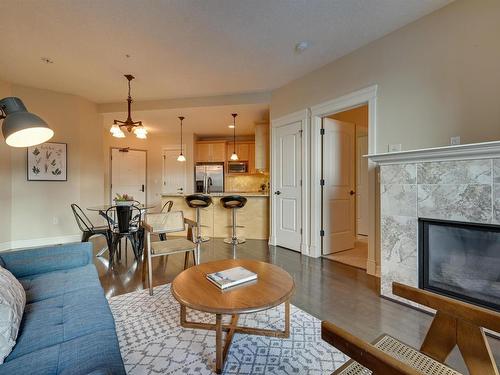 807 10142 111 Street, Edmonton, AB - Indoor Photo Showing Living Room With Fireplace