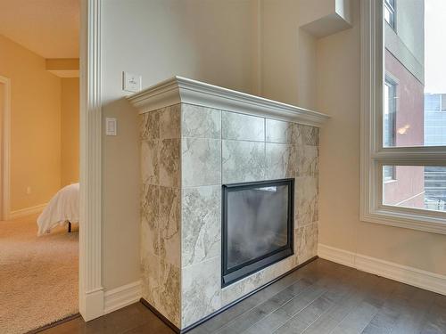 807 10142 111 Street, Edmonton, AB - Indoor Photo Showing Other Room With Fireplace