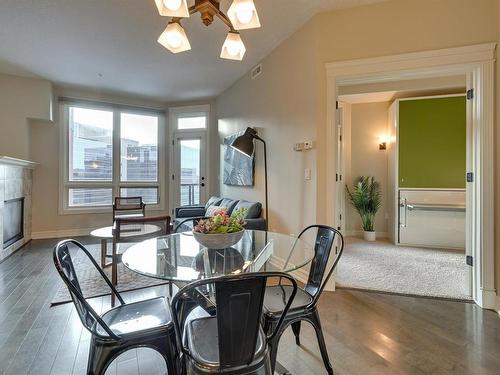 807 10142 111 Street, Edmonton, AB - Indoor Photo Showing Dining Room With Fireplace