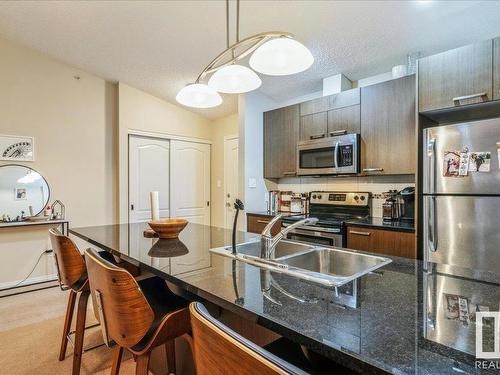 9351 Simpson Drive, Edmonton, AB - Indoor Photo Showing Kitchen With Stainless Steel Kitchen With Double Sink With Upgraded Kitchen