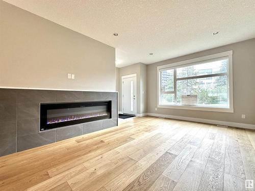 8422 117 Street, Edmonton, AB - Indoor Photo Showing Living Room With Fireplace