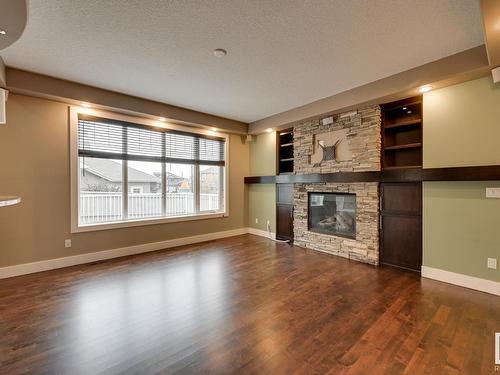 5258 Mullen Crest, Edmonton, AB - Indoor Photo Showing Living Room With Fireplace