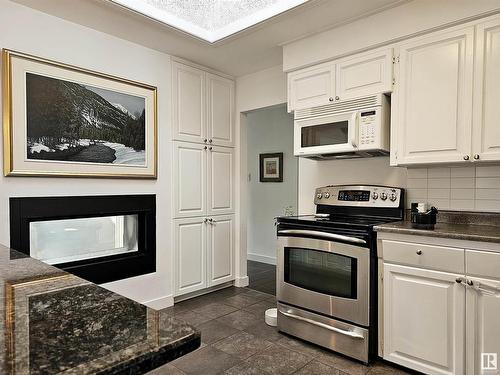 9535 148 Street, Edmonton, AB - Indoor Photo Showing Kitchen With Fireplace