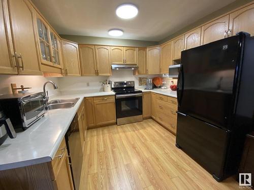 211 10935 21 Avenue, Edmonton, AB - Indoor Photo Showing Kitchen With Double Sink