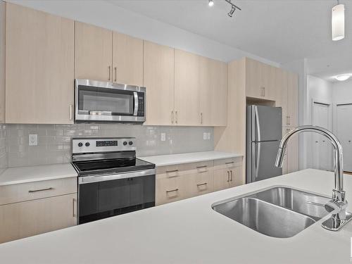 303 17 Columbia Avenue, Devon, AB - Indoor Photo Showing Kitchen With Stainless Steel Kitchen With Double Sink