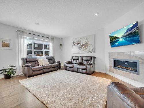 181 Sheppard Circle, Leduc, AB - Indoor Photo Showing Living Room With Fireplace