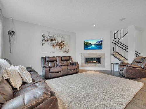 181 Sheppard Circle, Leduc, AB - Indoor Photo Showing Living Room With Fireplace