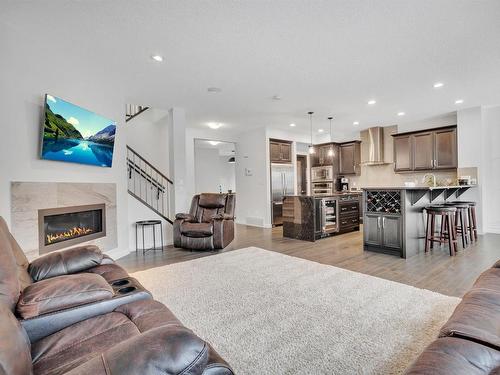 181 Sheppard Circle, Leduc, AB - Indoor Photo Showing Living Room With Fireplace