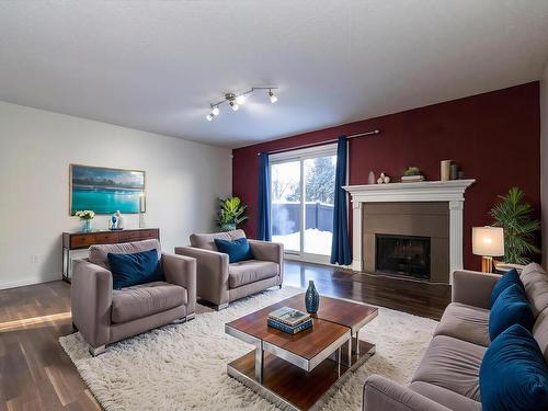 173 Tudor Lane, Edmonton, AB - Indoor Photo Showing Living Room With Fireplace