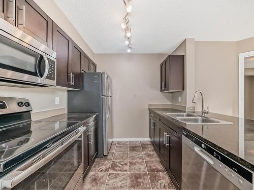 107 18122 77 Street, Edmonton, AB - Indoor Photo Showing Kitchen With Stainless Steel Kitchen With Double Sink