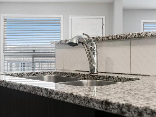 17039 38 Street Nw, Edmonton, AB - Indoor Photo Showing Kitchen With Double Sink