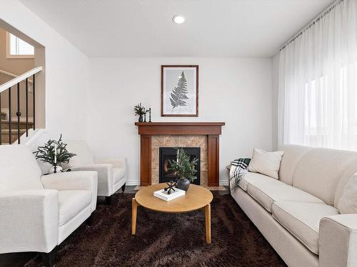 16106 10 Avenue, Edmonton, AB - Indoor Photo Showing Living Room With Fireplace