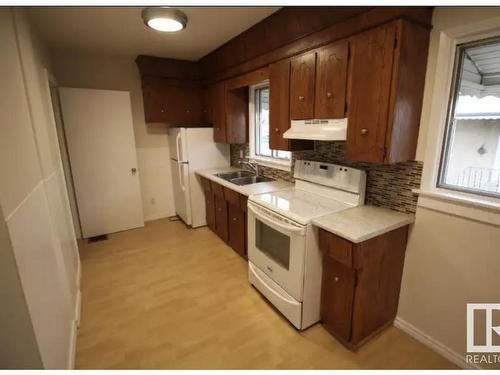 4761 50 Avenue, Vegreville, AB - Indoor Photo Showing Kitchen With Double Sink