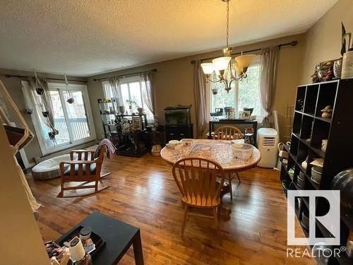 208 14803 51 Avenue, Edmonton, AB - Indoor Photo Showing Dining Room With Fireplace