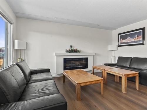 1122 33A Street, Edmonton, AB - Indoor Photo Showing Living Room With Fireplace