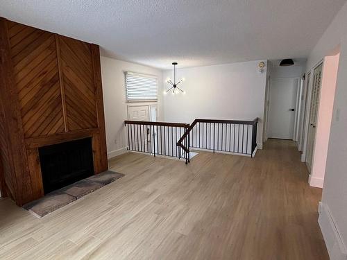 5615 92C Avenue Nw, Edmonton, AB - Indoor Photo Showing Other Room With Fireplace