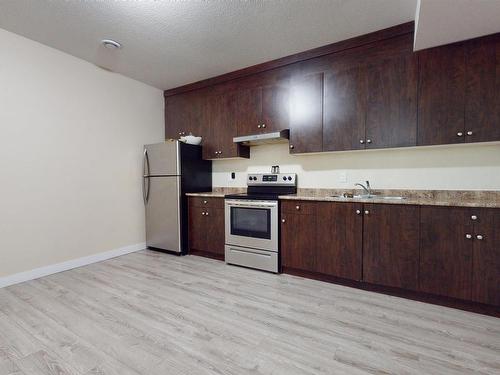 2617 21A Avenue, Edmonton, AB - Indoor Photo Showing Kitchen With Double Sink