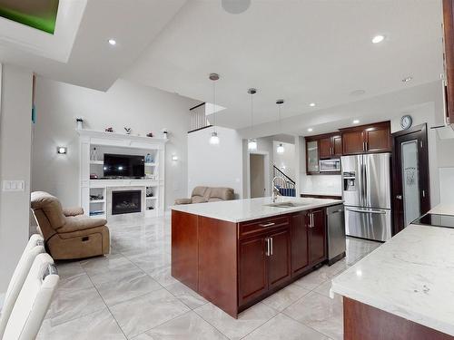 2617 21A Avenue, Edmonton, AB - Indoor Photo Showing Kitchen With Fireplace With Stainless Steel Kitchen