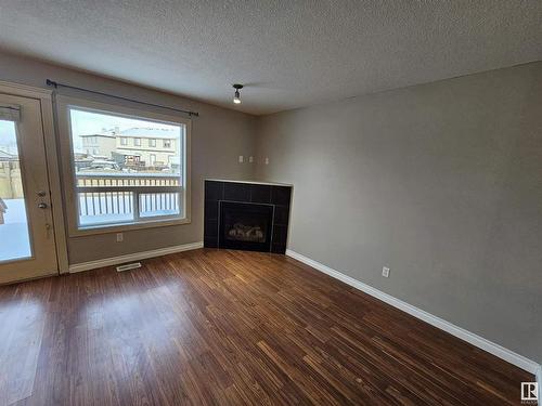 117 101 Drive, Leduc, AB - Indoor Photo Showing Other Room With Fireplace